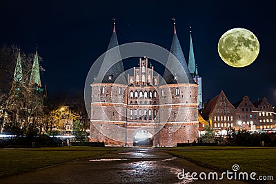 Holstentor Luebeck in Germany with Moon Stock Photo