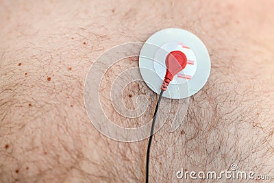 Holter monitor device sensor on human male body. Daily cardiogram examination. Excess fat person. High risk of cardial Stock Photo