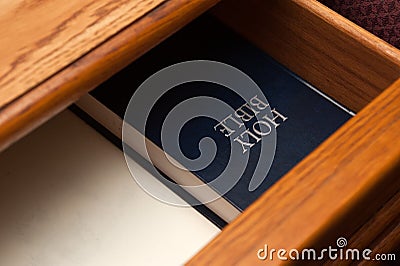 Holy Bible book in drawer Stock Photo