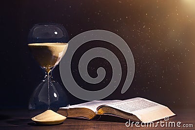 Holy Bible and Countdown Hourglass Stock Photo