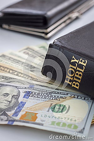 Holy Bible and money Stock Photo