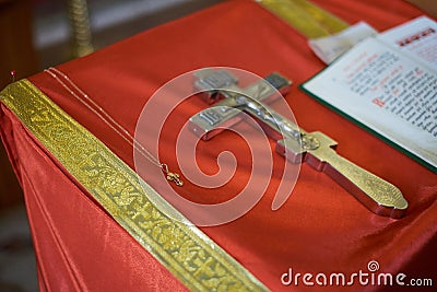 Holy Bible, Orthodox cross and Bowl prepared for christening ceremony Stock Photo