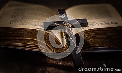 Holy bible with wooden cross Stock Photo