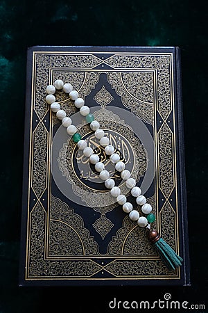 Holy book of Quran with rosary, Ramadan concept Stock Photo