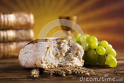 Symbol christianity religion a golden chalice with grapes and br Stock Photo