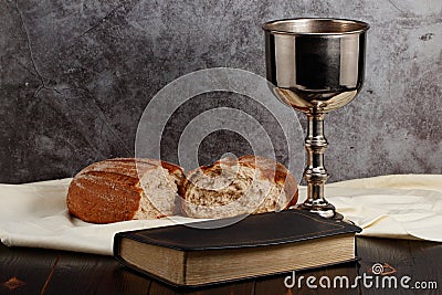 Holy communion chalice with wine and bread Stock Photo