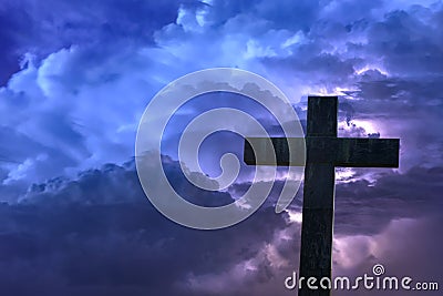 Holy cross under a blue stormy sky Stock Photo
