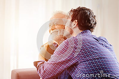 Man kiss elder, son greeting meeting old man for love grandfather in Respect for the Aged Day Stock Photo