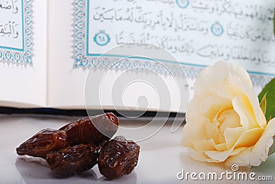 Holy Islam book some dates and rose Stock Photo
