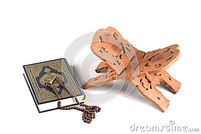 Holy islamic book Koran closed with rosary Stock Photo