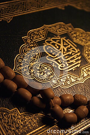 Holy Koran book & rosary Stock Photo