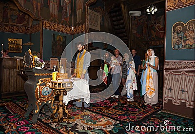 The Holy Orthodox rite of the sacrament of baptism newborn baby Editorial Stock Photo