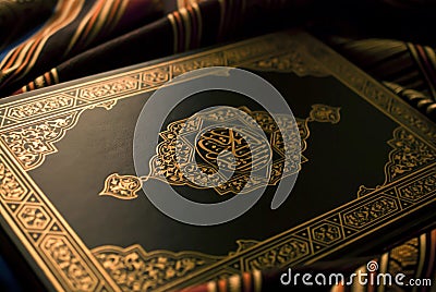 Glimmer of Faith: Quran in Golden Light Stock Photo