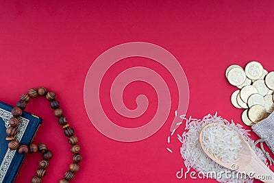Holy Quran, Coins,Rosary and rice. Zakat concept. Stock Photo