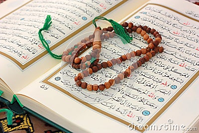 Holy Quran with wooden rosary Stock Photo