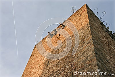 Homage Tower of Olivenza castle with plane trail Stock Photo