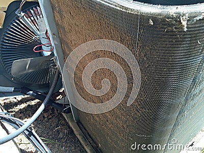 Home air conditioner dirty condenser coil fins Stock Photo