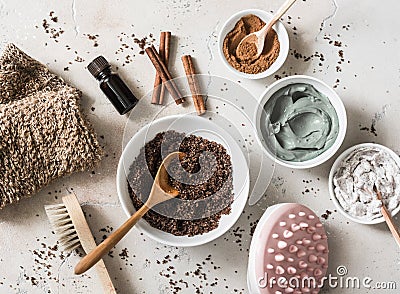 Home anti-cellulite products - coffee scrub, cosmetic clay, essential orange oil, hand anti-cellulite massager, nut scrub, Stock Photo