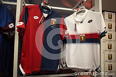 Home and away shirt of Genoa 1893 football team on sale in Genoa Shop at Genoa `Porto Antico` area, Italy. Editorial Stock Photo