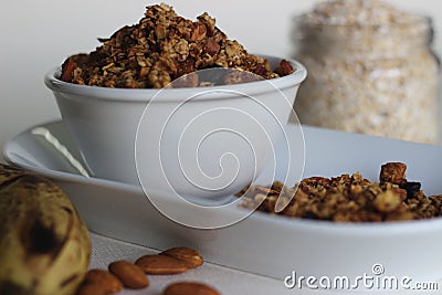 Home baked Banana granola made of overly ripe banana, oats, cinnamon powder, almonds and raisins Stock Photo