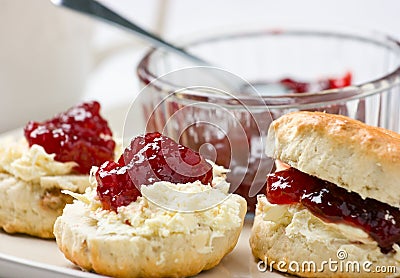 Home baked scones with strawberry jam and clotted Stock Photo