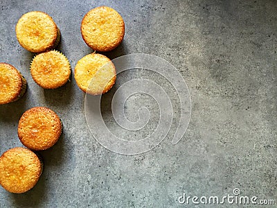 Home baking: mini lemon semolina cakes in paper cupcake holders Stock Photo