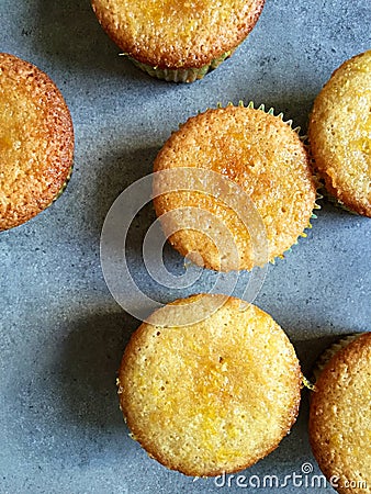 Home baking: mini lemon semolina cakes in paper cupcake holders Stock Photo