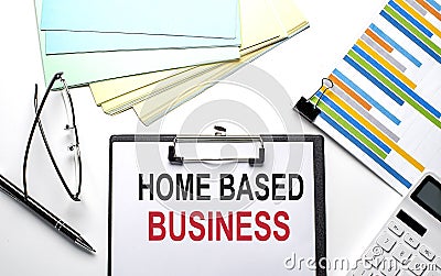 HOME BASED BUSINESS text on paper sheet with chart,color paper and calculator Stock Photo