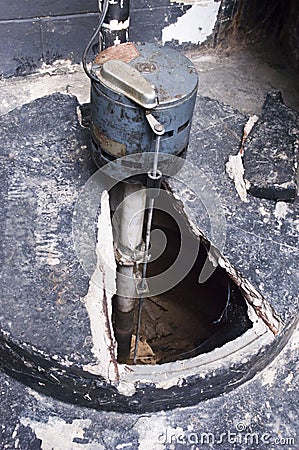 Home Basement Sump Pump, Water Crock Tank Plumbing Stock Photo