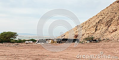 The home of a Bedouin family is located at the foot of a mountain near Wadi Numeira gorge in Jordan Editorial Stock Photo