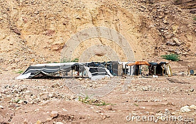 The home of a Bedouin family is located at the foot of a mountain near the Wadi Numeira gorge in Jordan Editorial Stock Photo