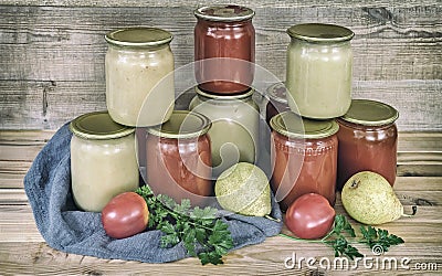 Home canning: pear puree, and tomato juice Stock Photo