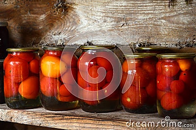 Home canning. Pickles in glass jars.Pickled tomatoes. Stock Photo