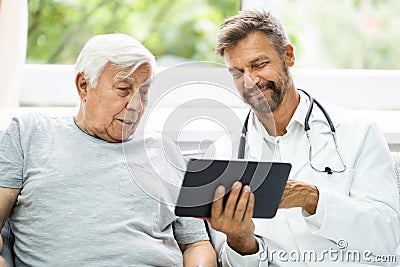 Home Care Elder Patient Looking At XRay Images Stock Photo