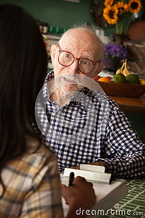 Home with care provider or survey taker Stock Photo