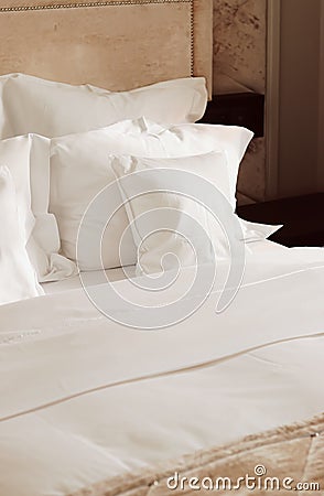 Home decor and interior design, bed with white bedding in luxury bedroom, bed linen laundry service and furniture detail Stock Photo