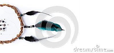 A unique mystical dream catcher made of willow vines, white threads, beads, and colored feathers. Banner with a white background Stock Photo