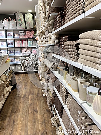 Home Decorations In Decorations Store. Modern textile shop for towels and interior decor. Editorial Stock Photo