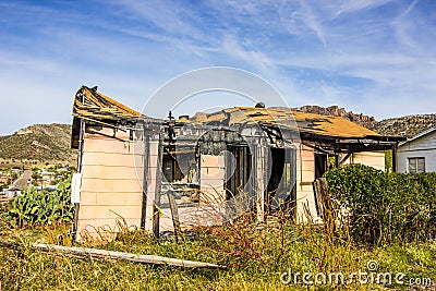 Home Destroyed By Fire With Caved In Roof Stock Photo