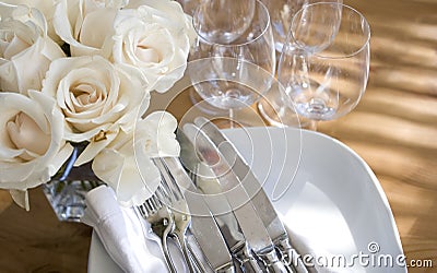 Home entertaining: flowers & sparkling dishes Stock Photo