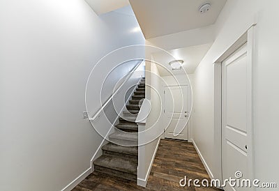Home entrance interior with staircase and hallway with wooden flooring Stock Photo