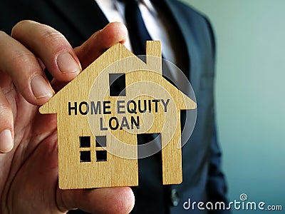 Home Equity Loan sign on a wooden model of house Stock Photo