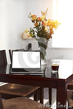 Home freelance desktop with open laptop computer, cup of coffee, business person net-book with blank screen for Stock Photo