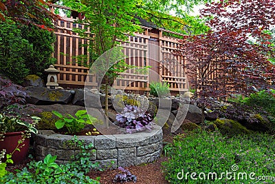 Home Garden Backyard Landscaping with wood trellis Stock Photo