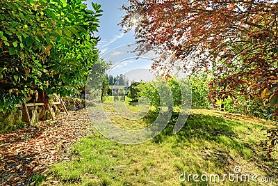 Home garden with outdoor rest area Stock Photo