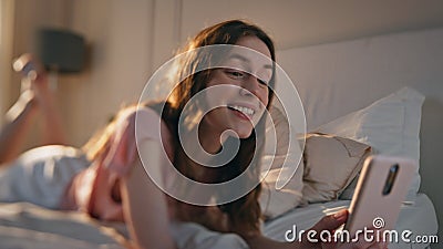 Home girl talking video conference closeup. Relaxed teenager lying morning bed Stock Photo