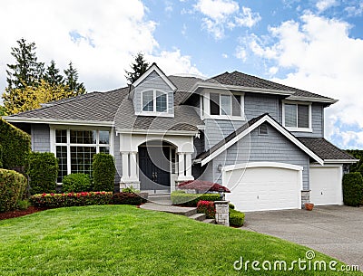 Home and healthy front yard during late spring season Stock Photo