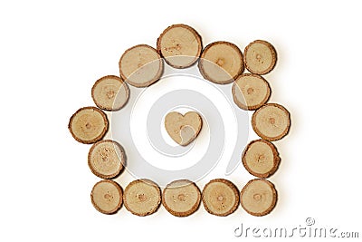Home with heart made of wood slices on white background Stock Photo
