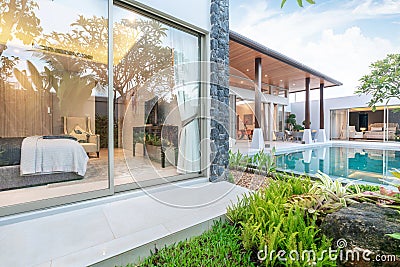 Home or house Exterior design showing tropical pool villa with greenery garden and bedroom Stock Photo