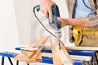 Home improvement - handyman drilling wood Stock Photo